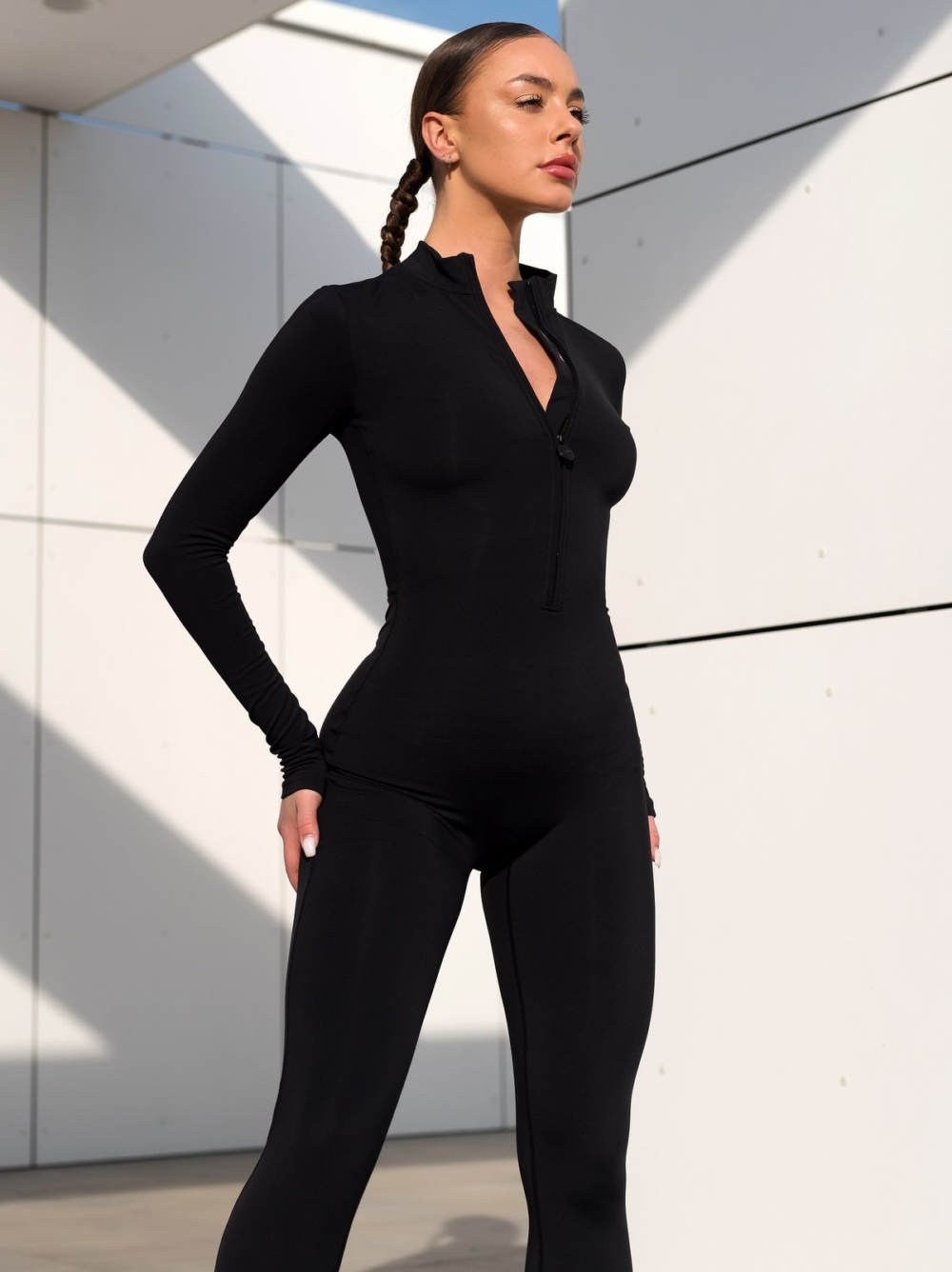 Sporty black overalls with zipper and Peach Pump logo