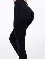 Black sports set made of elastic, seamless fabric, shaping effect