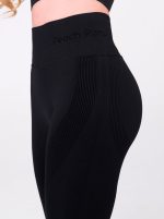 Black two-piece sports set with push-up bra and shaping leggings by Peach Pump