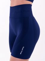 Sportowe granatowe bezszwowe legginsy z wysokim stanem i białym napisem Peach Pump