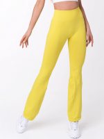 Legginsy z wysokim stanem w żółtym kolorze wykonane z elastycznego, bezszwowego materiału