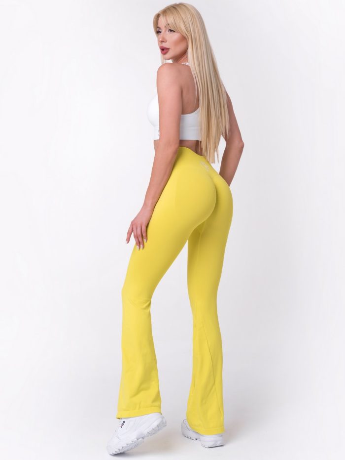Modne, żółte, damskie legginsy typu Charleston z wysokim stanem