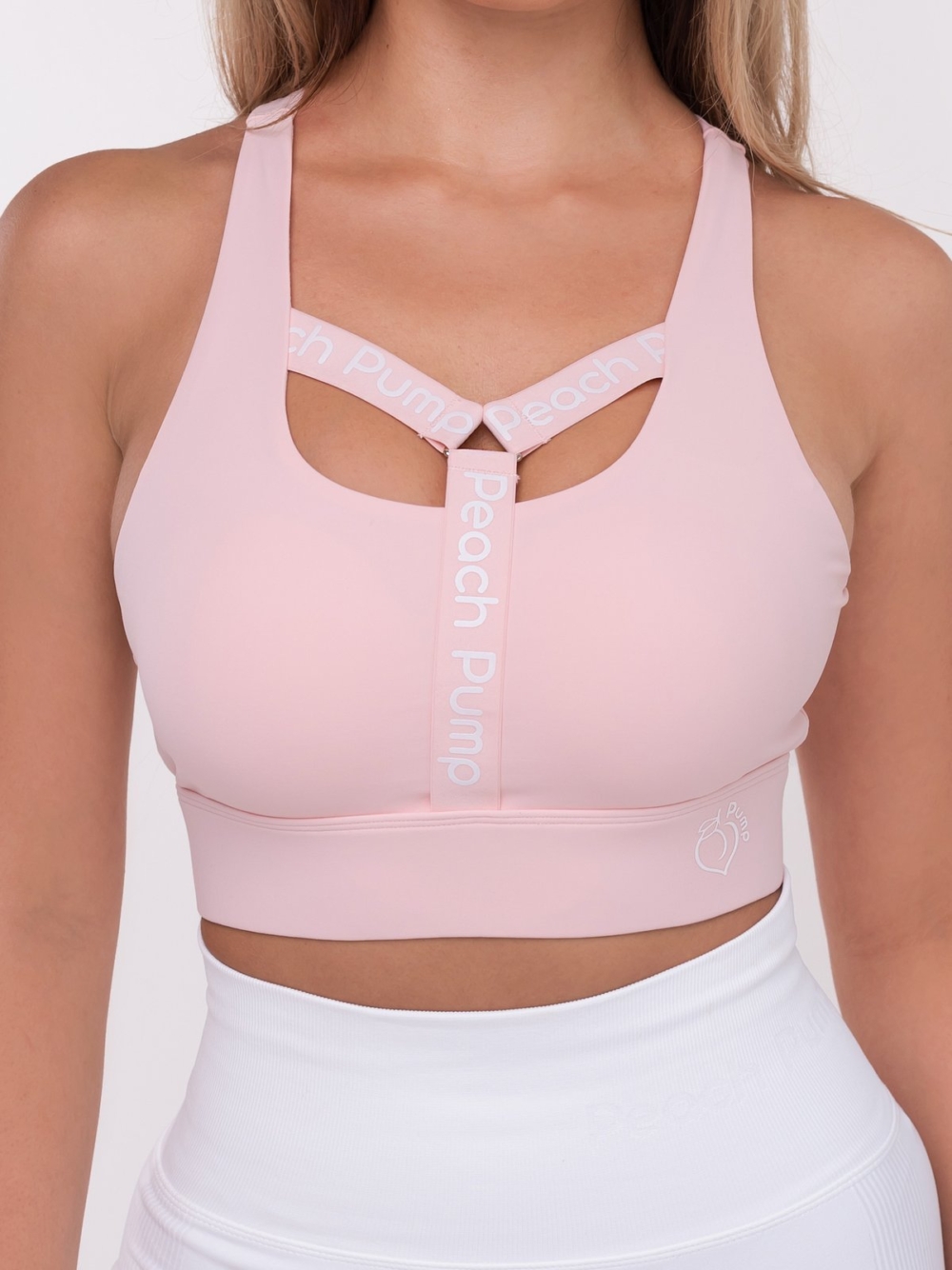 Růžová sportovní podprsenka s nápisem Peach Pump Y