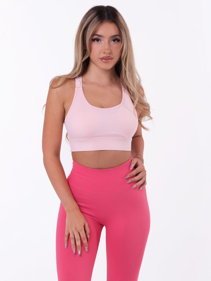 Light pink sports bra with Push-up padding, multi-stage fastening and white lettering on the straps