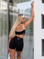 Stretchy black sports leggings and sports bra set with padding