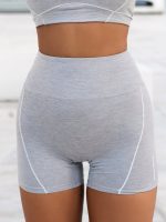 Grey sports leggings made of elastic, breathable fabric, without seam in the front
