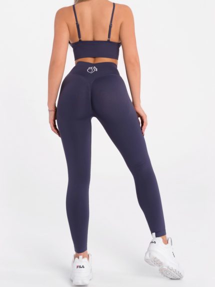 Sporty, seamless, blue-grey low-waisted leggings and bustier set from Peach Pump.