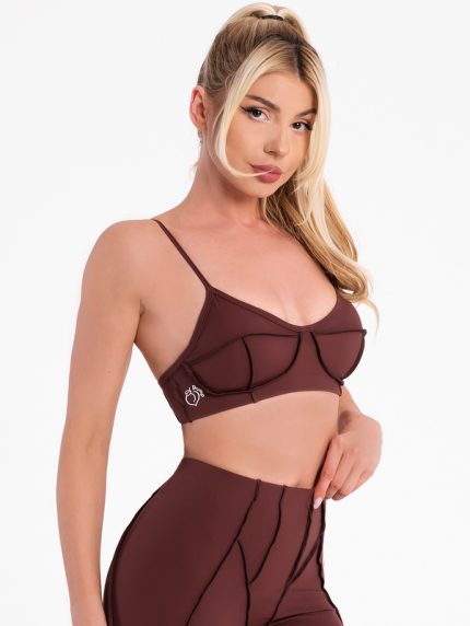 Brown sports bra with inverted seams and padding with push-up effect