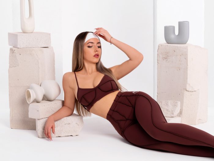 Brown sports bra with 3D inverted seams and padding by Peach Pump