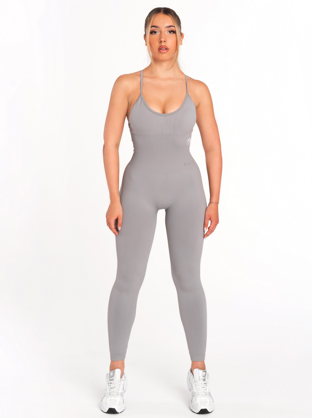 Seamless grey sports overalls on body with padding