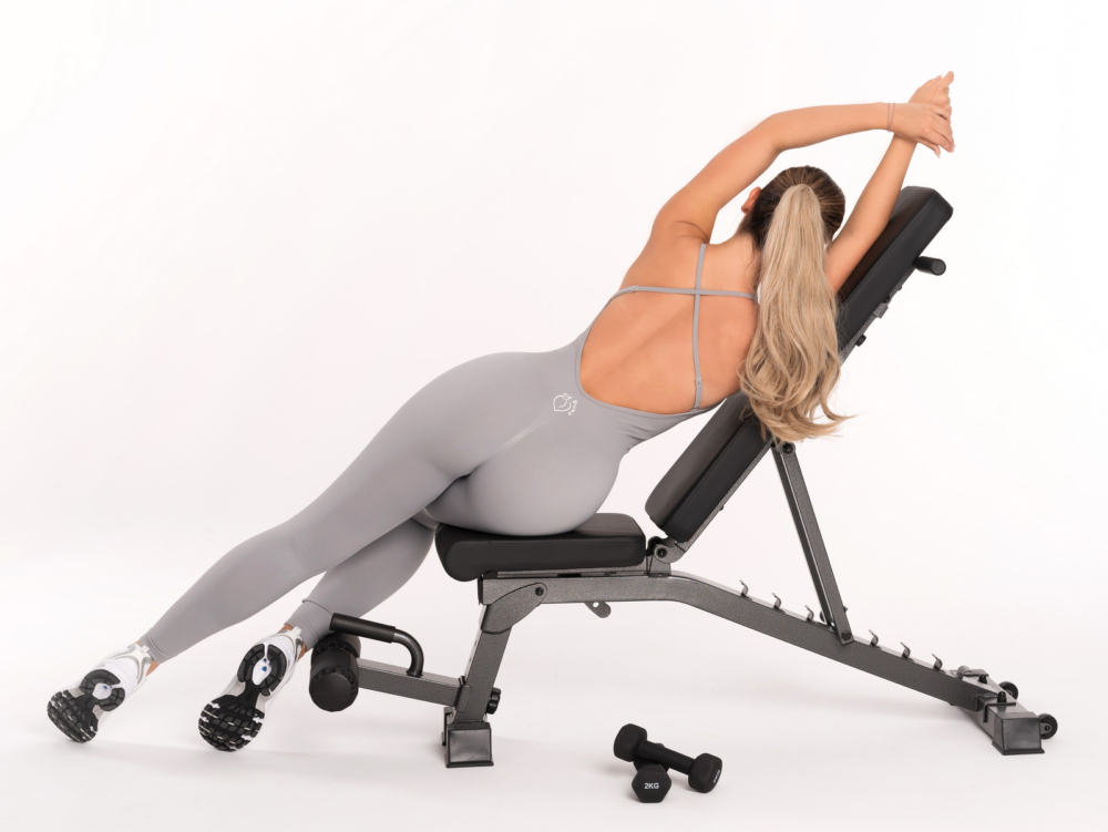 Grey sports overalls with shaping effect and thin, adjustable straps with cross back
