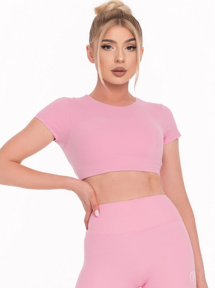 Set sport roz din două piese cu bluză scurtă căptușită și colanți sport scurți