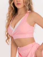 Pink sports bra with a deep V-neck and removable pads