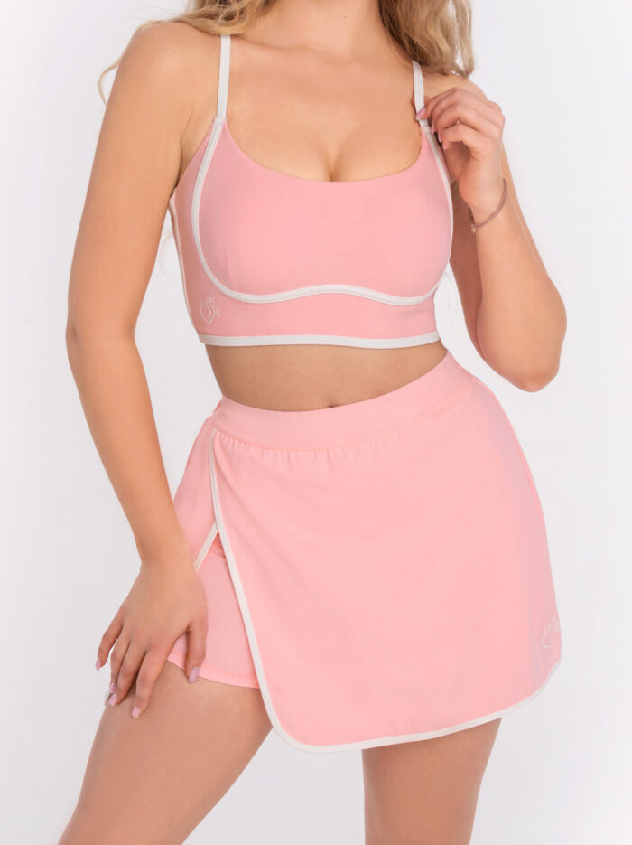 Ροζ αθλητικό μπουστάκι με λευκή μπορντούρα κάτω από το μπούστο και ενίσχυση που μπορεί να αφαιρεθεί