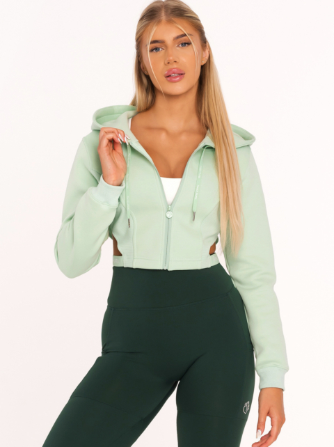 Cropped green zip hoodie — sporty confident green hoodie look