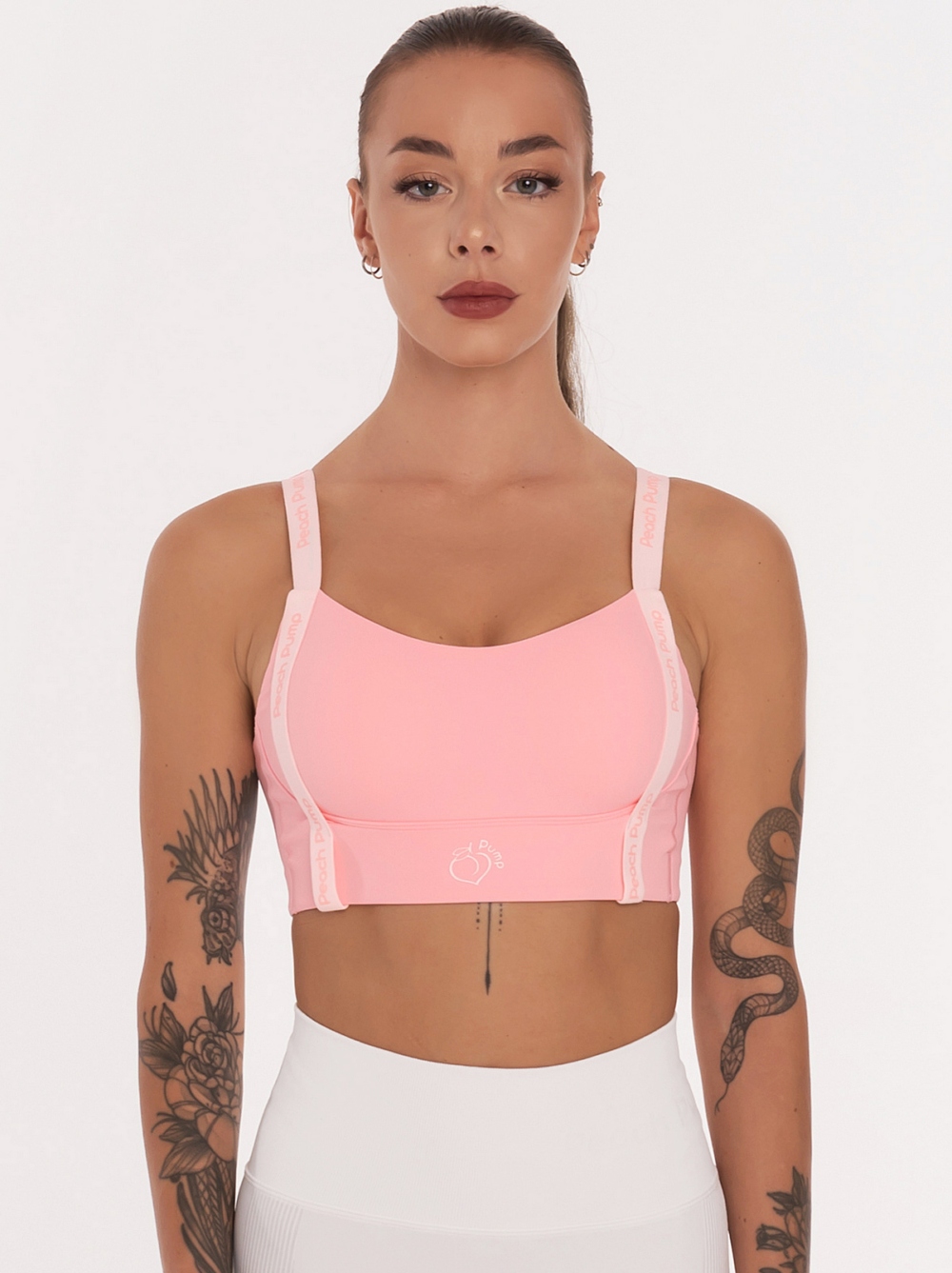 Pink sports bra with front lettering along the length Peach Pump and padding