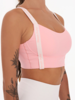 Pink bra with pink Peach Pump lettering along the length