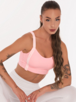 Modern pink sports bra with white straps and pink Peach Pump lettering