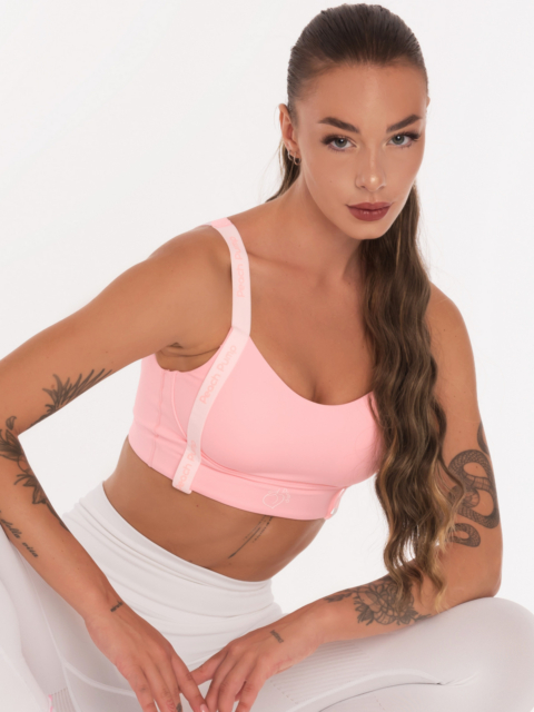 Divatos rózsaszín sportmelltartó fehér pántokkal és rózsaszín Peach Pump feliratokkal