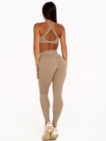 Bustieră sportivă de culoare bej, cu un design simplu și o deschidere elegantă în față, pentru un look modern.