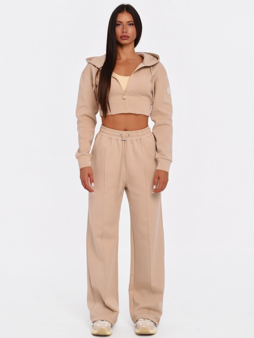Beiger Damen Cropped Hoodie mit femininem Korsett-Design.