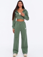 Women's green gym set with cropped hoodie and wide leg joggers.